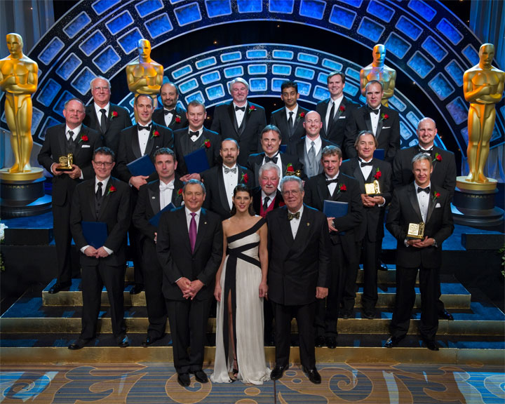 Oscar Academy President Tom Sherak, Host Marisa Tomei and Richard Edlund, Governor of the Academy's Visual Effects Branch, with the 2010 winners.